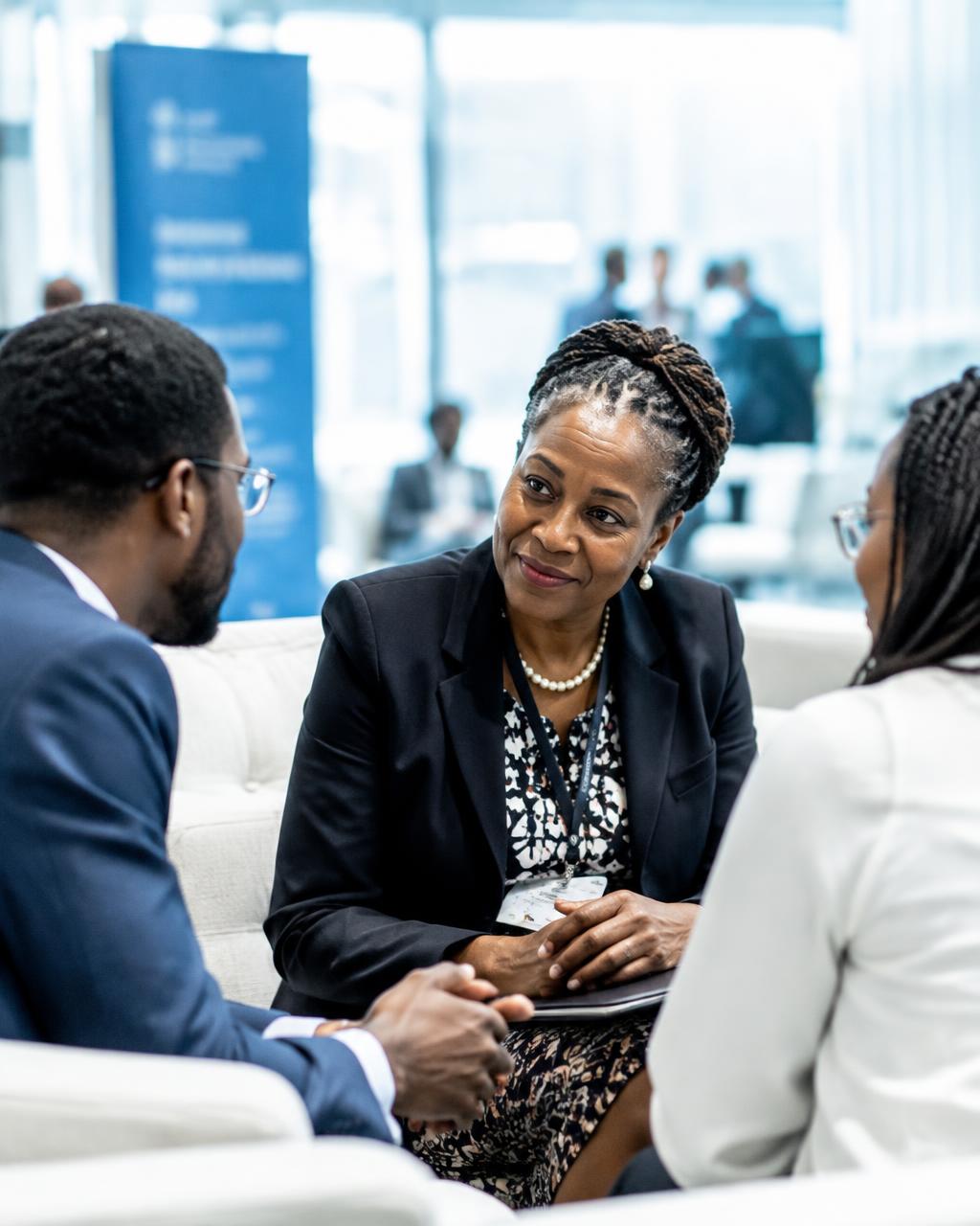 A senior advisor guiding two entrepreneurs